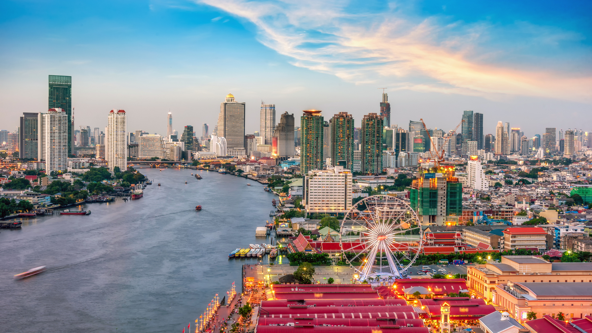 Bangkok skyline along the Chao Phraya River at sunset
